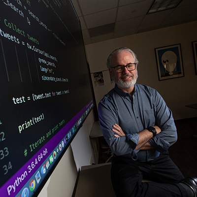 Curt Rode, Ph.D., stands in the CDEX Classroom