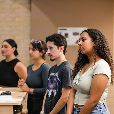 Students attend a film festival for AddRan College inside the Sid Richardson Building. Photo by James Anger on March 29, 2022.