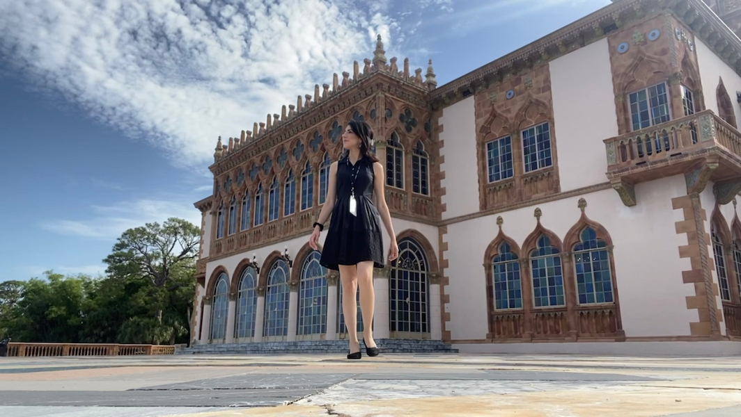 Woman in front of a building